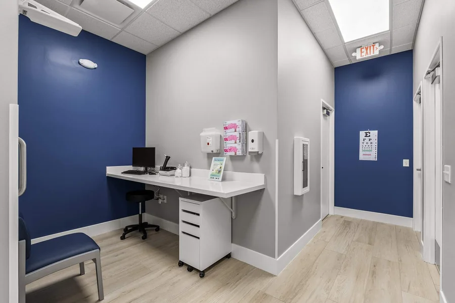 MY DR NOW: MY DR NOW consultation room with fitted desk and blue accent wall